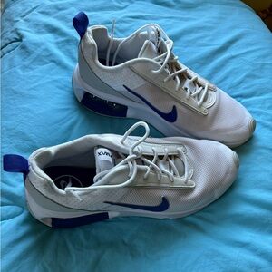 White Nike Air Max with blue accents. Barely worn. Very comfortable. Size 10
